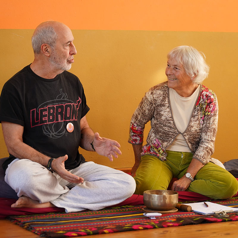 ganga and avikal sitting on a matress